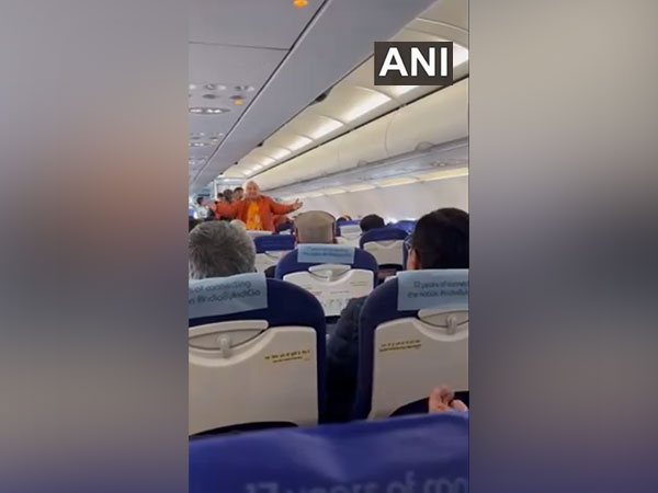 Visuals of passengers singing inside flight. (Photo/ANI)
