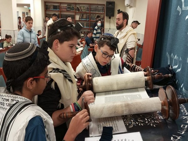 Amichai Jackson reads from the Torah at his bar mitzvah in Elazar, in the Gush Etziyon region south of Jerusalem. (Photo/TPS)