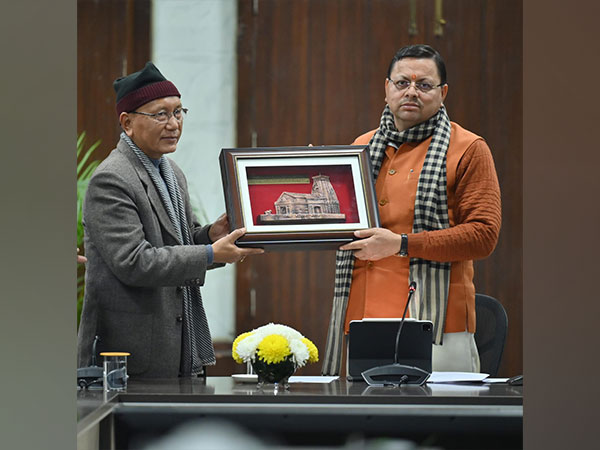 Uttarakhand Chief Minister Pushkar Singh Dhami honours Transport Corporation official (Photo/ANI) 