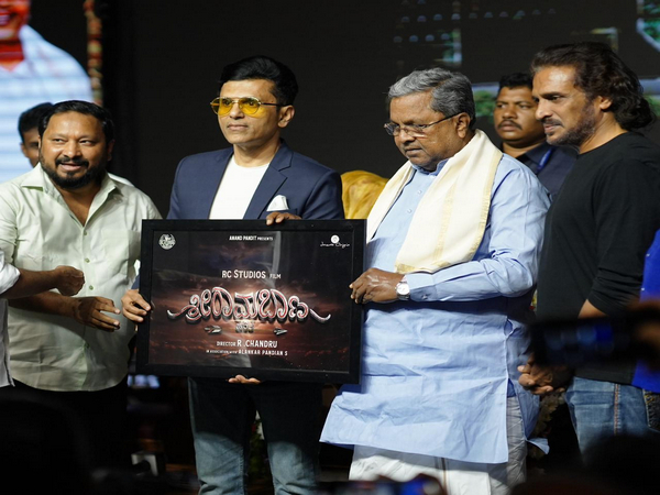 Minister Siddaramaiah and producer Anand Pandit