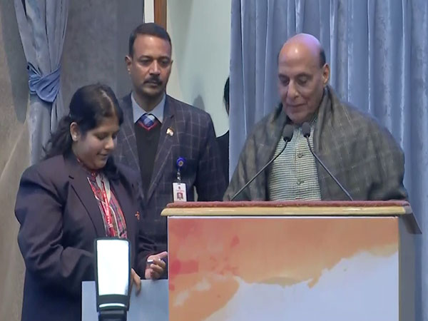 Defence Minister Rajnath Singh with student. (Photo/ANI)