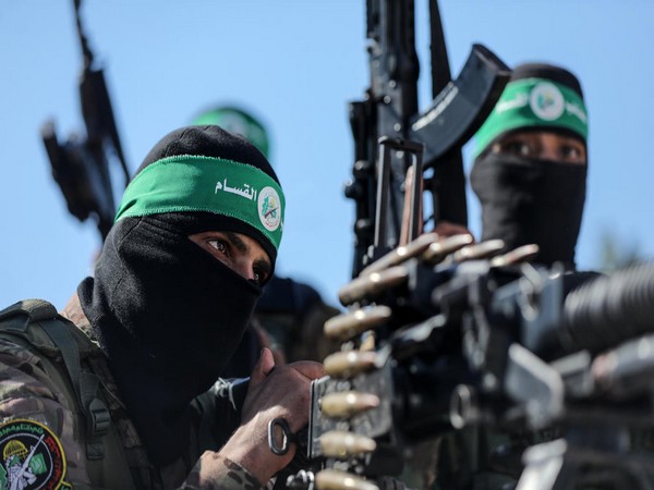 Hamas terrorists at a Gaza rally (Photo/TPS)