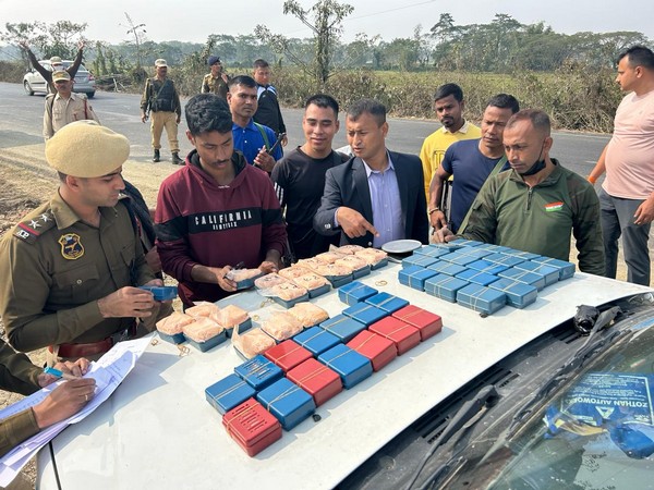 Assam police with seized heroin (Photo/ANI)
