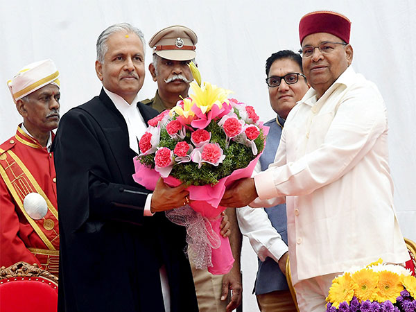 Governor of Karnataka Thawar Chand Gehlot administers the oath to Justice PS Dinesh Kumar(Photo/ANI)