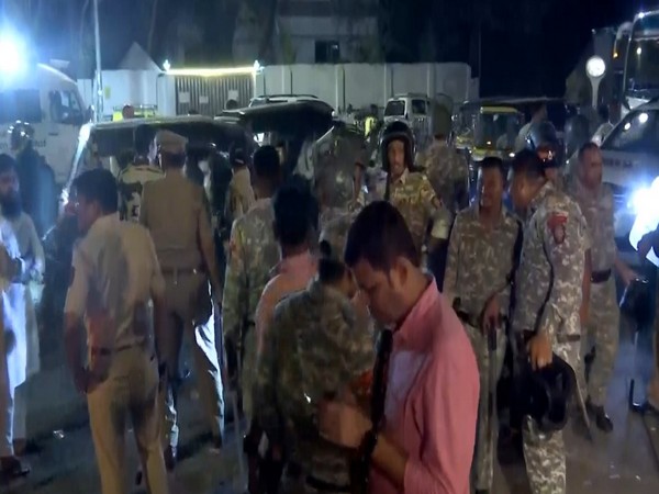 Hevy force deployed outside Ghatkopar police station. (Photo/ANI)