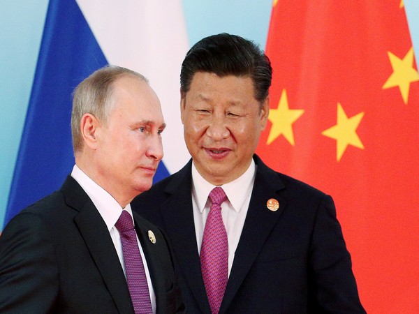 Russian President Vladimir Putin with Chinese President Xi Jinping. (Photo Credit: Reuters)