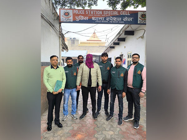 Officials with Amit Kumar who was arrested on Thursday (Photo/ANI)