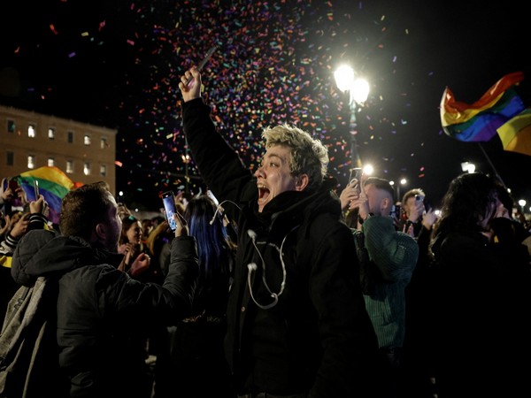 Same-sex couples celebrating after landmark decision by Greek Parliament (Photo credit: Reuters)