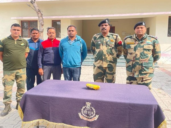 BSF officials with a packet of suspected heroin (Pic credit: BSF)