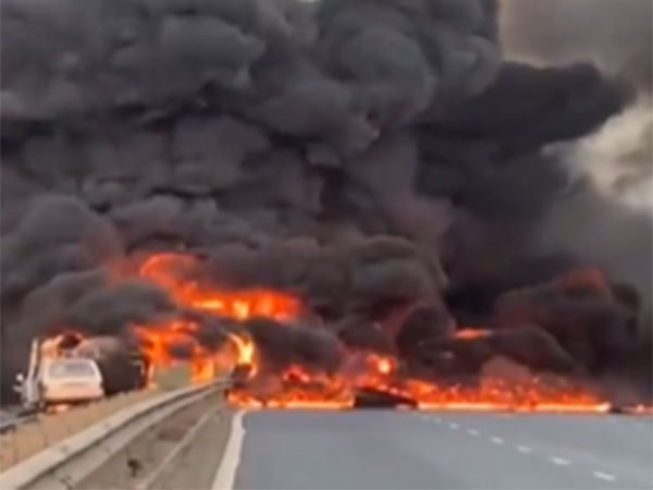 Fire broke out after tanker overturned on Ahmedabad-Mumbai National Highway (Photo/ANI)