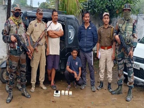Assam Rifles with the seized brown sugar and arrested drug peddler. (Photo/Assam Rifles)