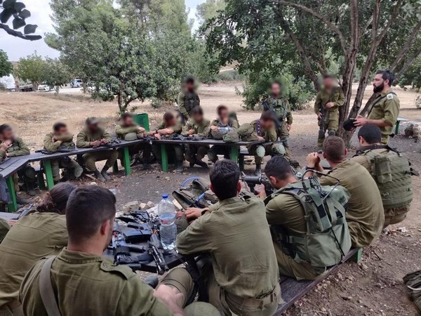 Israeli soldiers who recently served in Gaza meet with one of the army's mental health experts (Photo/TPS)
