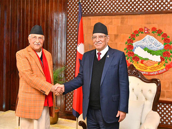 CPN-UML Chairman KP Sharma Oli (Left) and Nepal PM Pushpa Kamal Dahal (Right) shake hands before the start of the new coalition meeting on Monday (Image Credit: Nepal PM Secretariat)