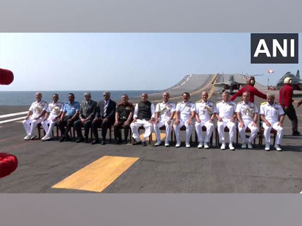 Defence Minister Rajnath Singh along with Naval officers onboard INS Vikramaditya (Photo/ANI)