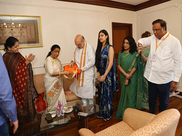 Union Home Minister Amit Shah releases photobiography book on legendary singer Asha Bhosle (Photo/ANI)