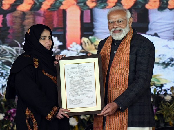 distributes an appointment letter during the 'Viksit Bharat Viksit Jammu Kashmir' program (Photo/ANI)