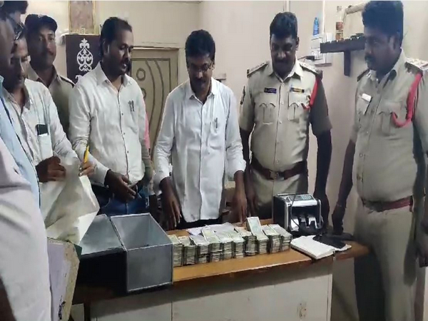 Police officials with seized cash (Photo/ANI)