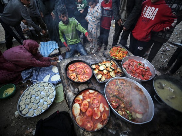 Palestinians in Gaza's Deir al-Balah refugee camp (Photo/TPS)