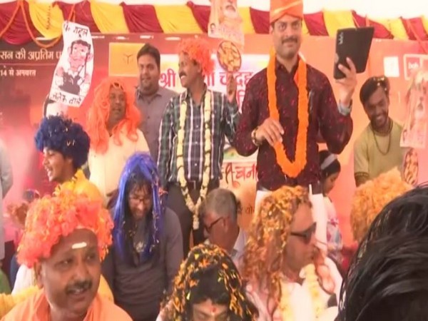 People celebrates Holi at Assi Ghat in Varanasi (Photo/ANI)