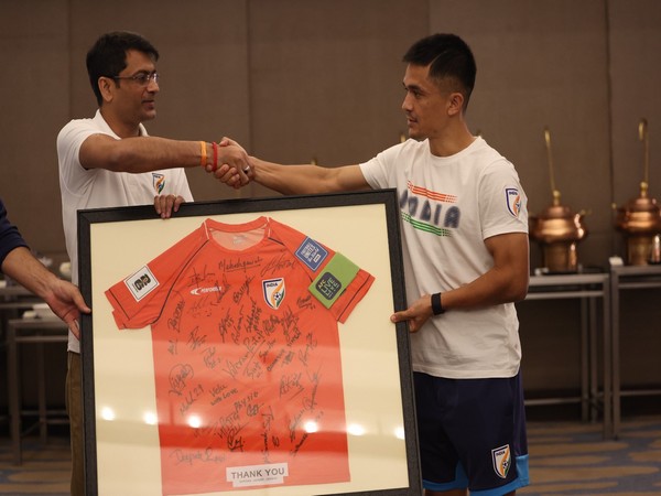 AIFF president Kalyan Chaubey presenting Sunil Chhetri with a team jersey ahead of his 150th appearance (Image: AIFF media)