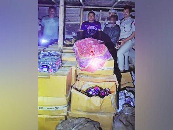 Police officials with seized yaba tablets (Photo/ANI)