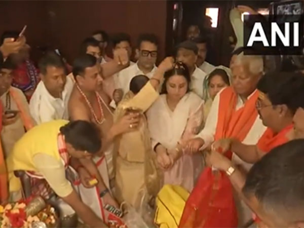 Lalu Prasad Yadav and his wife Rabri Devi offer prayers at Bihar’s Hariharnath temple  (Photo/ANI)