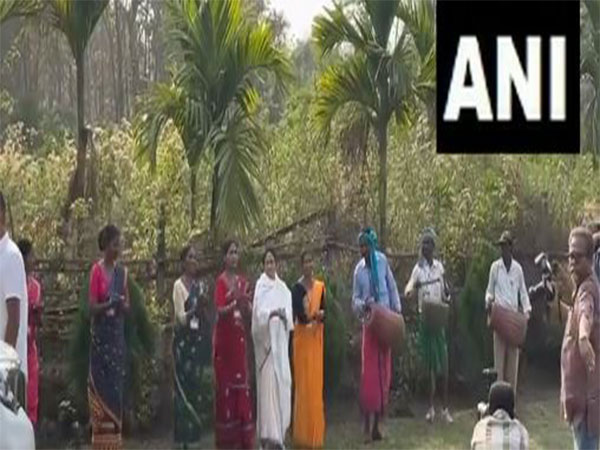 Mamata Banerjee plays drum, dances with tribals in Jalpaiguri (Photo/ANI)