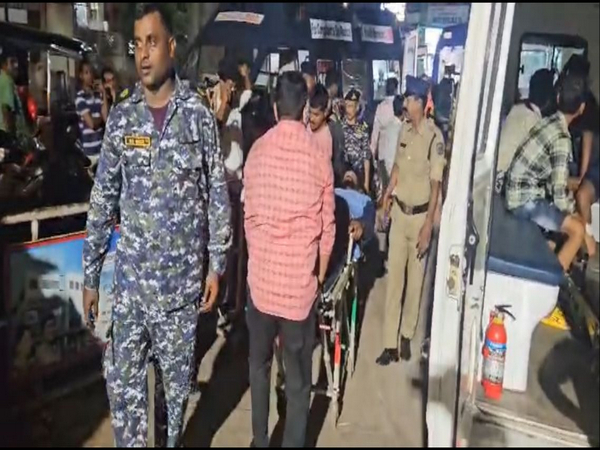 ICGS team provides first aid to injured fishermen. (Photo/ANI)