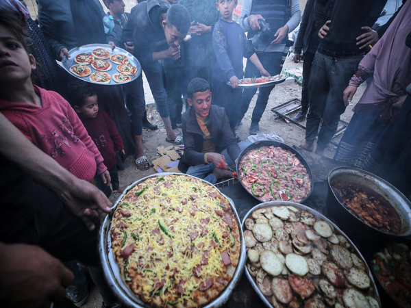 Palestinians from the refugee camp in Deir al-Balah (Photo/TPS)