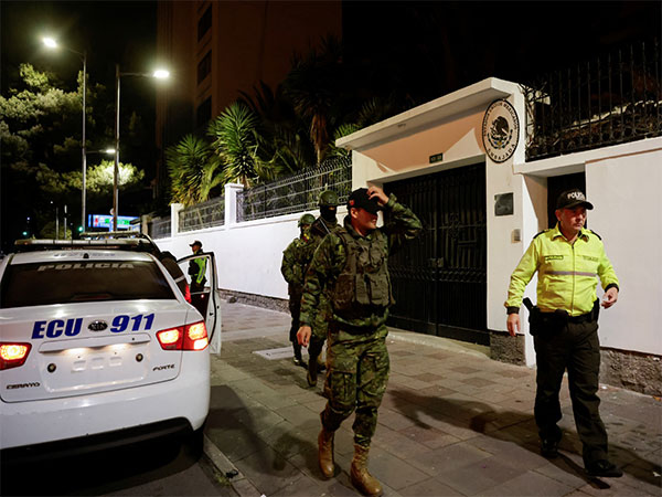 Police, military officials walk outside Mexican embassy in Quito from where former Mexican President Jorge Glas was arrested (Image Credit: Reuters)