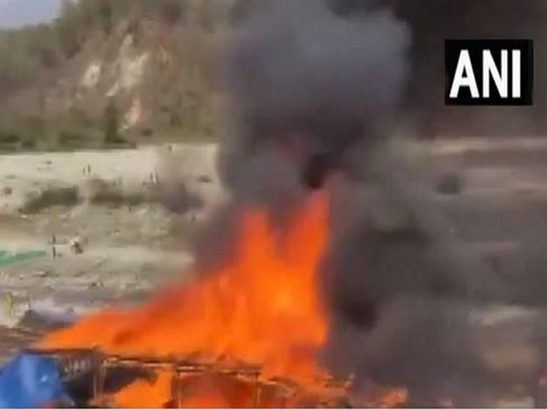 Fire in the shops of Garjiya Devi temple complex on Monday. (Photo/ANI)