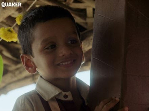 Child observes his mother at her Dohale Jevan