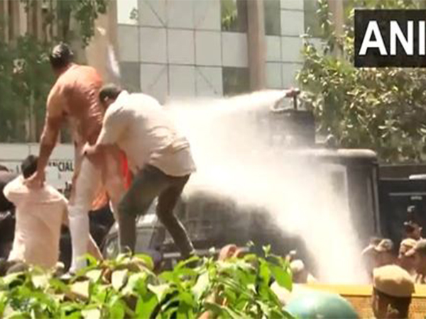 Police using water cannon againt protesting BJP workers (Photo/ANI)