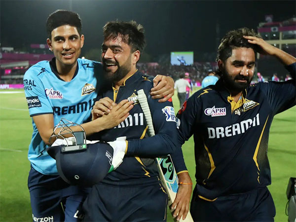 Rashid Khan celebrating with Shubman Gill (left) and Rahul Tewatia (right) (Photo: IPL)