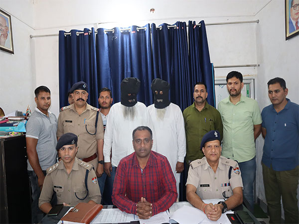 Uttarakhand police with the arrested accused. (Photo/ANI)