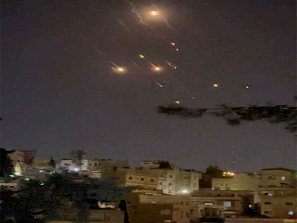 Objects are seen in the sky over Amman after Iran launched drones towards Israel (Photo/Reuters)
