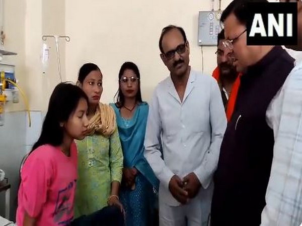 CM Dhami meeting injured in Khatima road accident (Photo/ANI) 