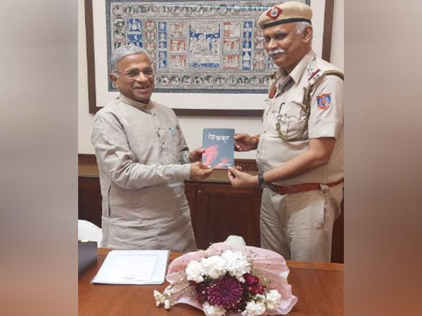 Keshav Bharadwaj presenting his book to the Deputy Chairman of the Rajya Sabha, Harivansh Narayan Singh