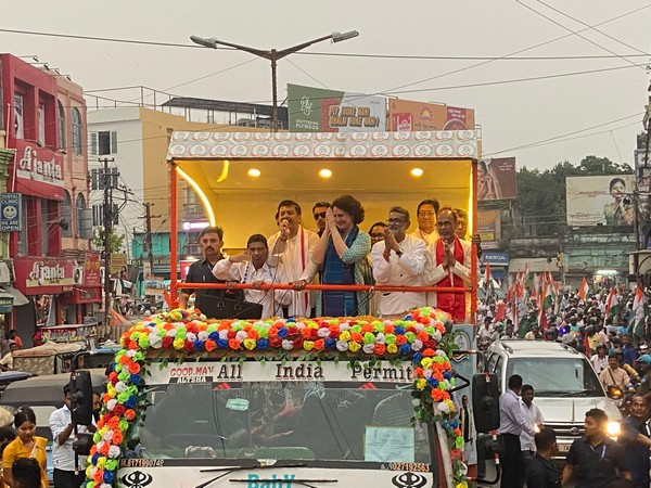Priyanka Gandhi Vadra at a roadshow in Agartala. (Photo/ANI)