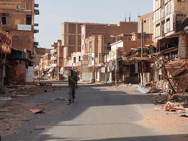 A member of the Sudanese Armed forces walks between damaged buildings, almost one year into the war between the SAF and the RSF in Omdurman, Sudan (Photo/Reuters)