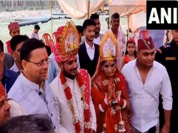 CM Dhami pays a surprise visit to a wedding in his hometown Khatima (Photo/ANI)