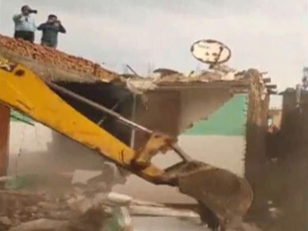 Guna district administration demolishes rape accused's house. (Photo/ANI)