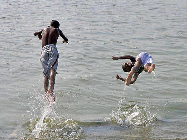 Children jump into the Ganges to beat heat in April 2024 (File/ANI Photo)