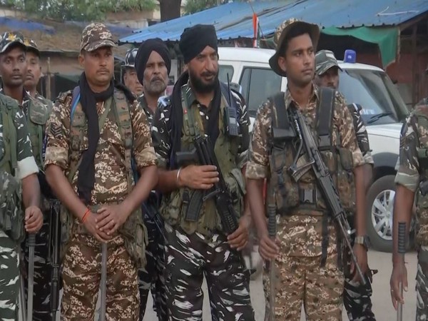Security personnel holding flag march ( Photo/ANI)