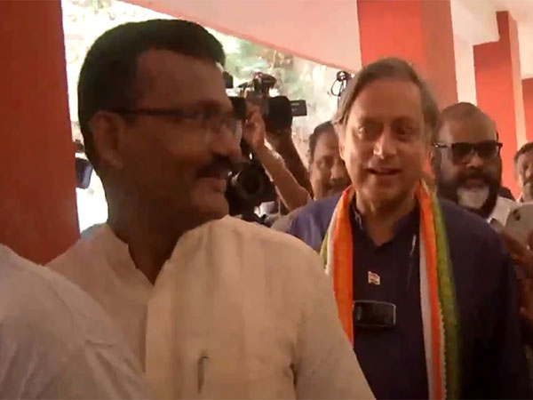 Congress leader Shashi Tharoor queues up to vote (Photo/ANI)