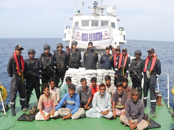 Indian Coast Guard along with apprehended crew members (Photo: X @IndianCoastGuard)