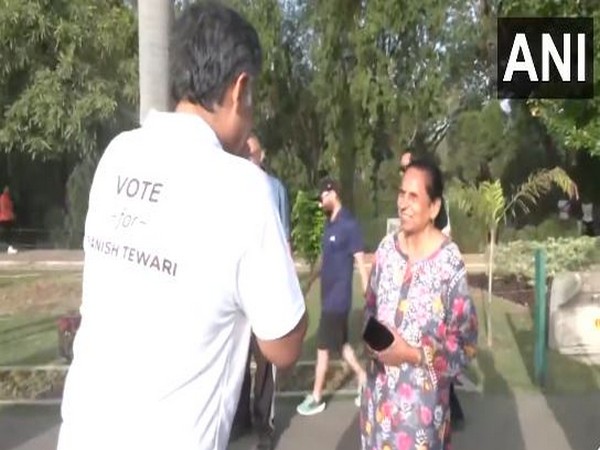 Congress candidate Manish Tewari interacts with locals during morning walk in Chandigarh (Photo/ANI)
