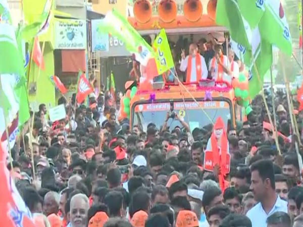 Union Home Minister Amit Shah during the roadshow in Haveri, Karnataka (Photo/ANI)