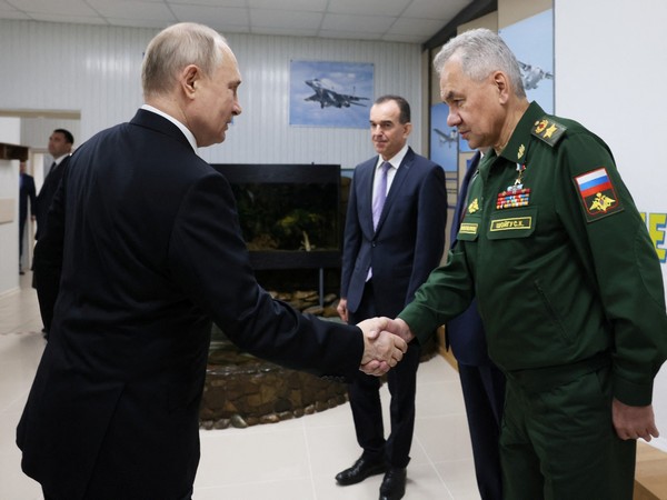 Russian President Vladimir Putin shakes hands with Defence Minister Sergei Shoigu in Krasnodar, Russia (Photo/Reuters)