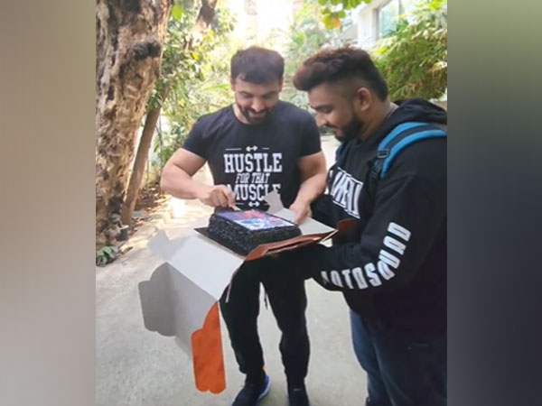 John Abraham with his fan (Image source: X)